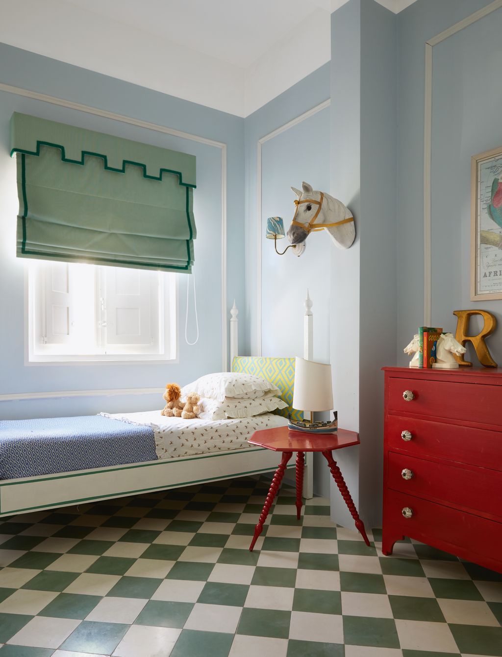 An inherited chest of drawers and an Italian table in the same red gloss set off a blind in fabric bought locally at JB...