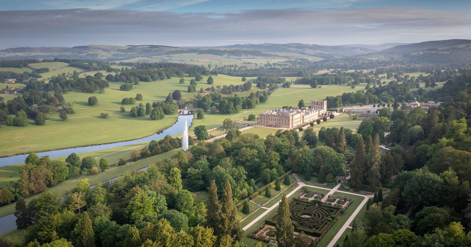 House in landscape summer. Maze Emperor Fountain River Derwent