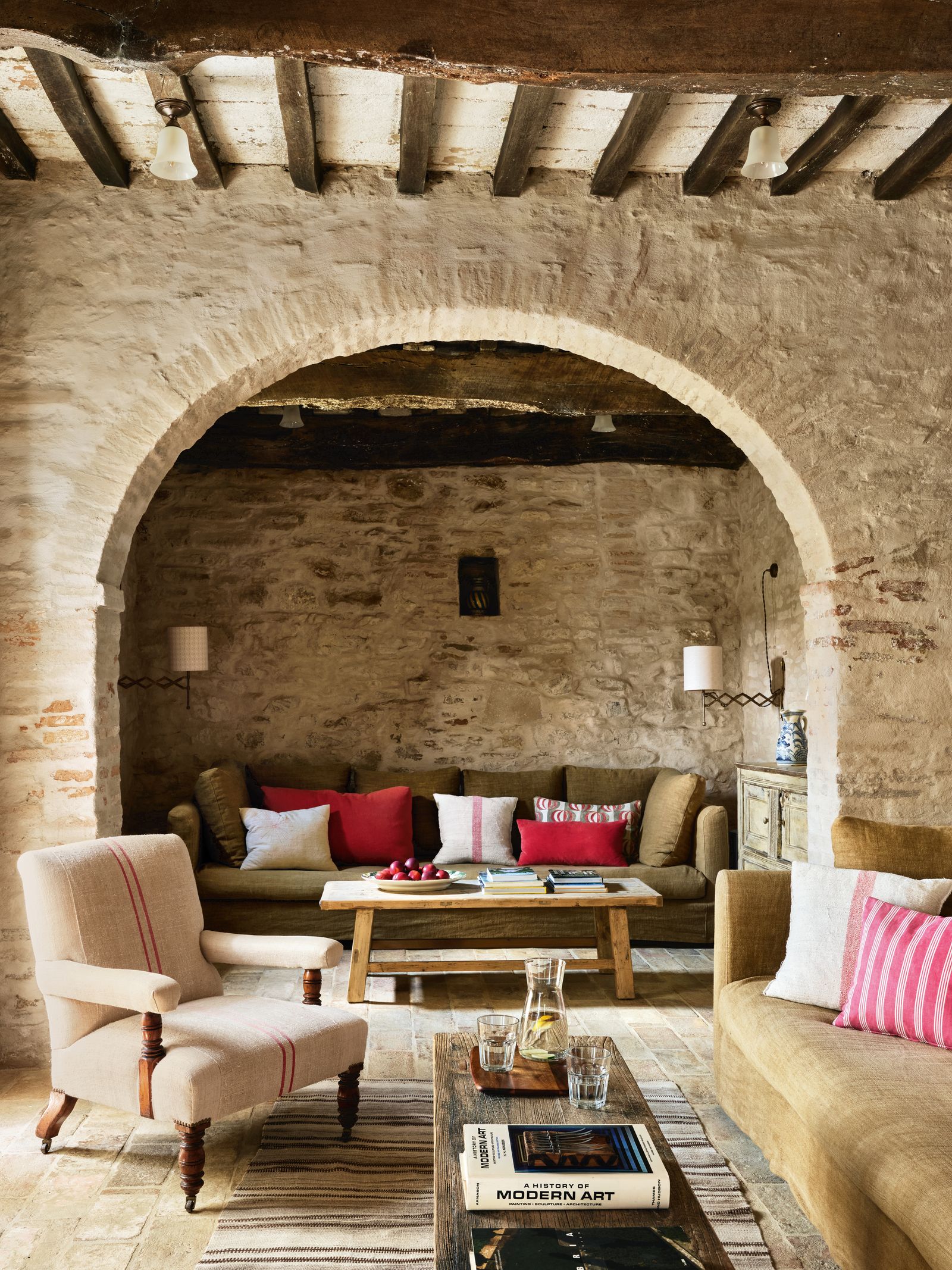 Vintage pieces upholstered in earthy linens with warmer accents provided by the cushions teamed with sturdy wooden...