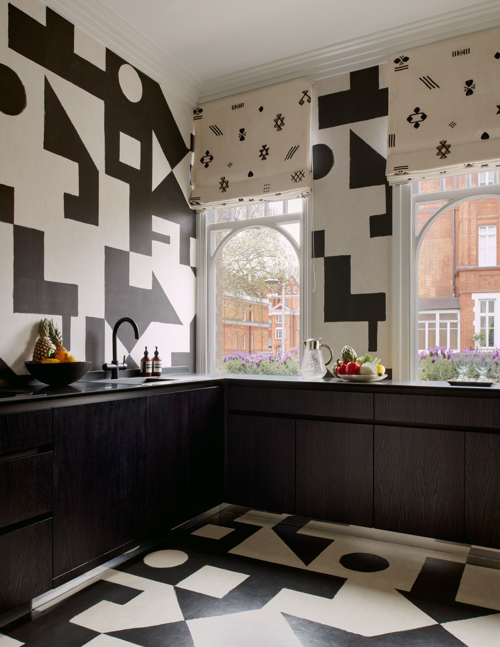 Benni Frowein used Porter Teleo's graphic Binary wallcovering panels on the walls and floor in his London flat