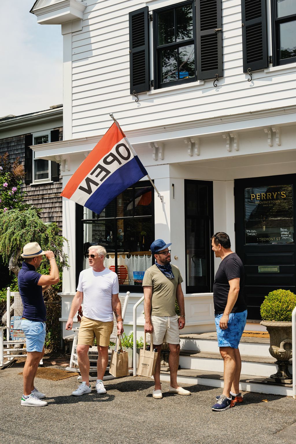 With friends Charlie and Billy who run a gourmet food and wine shop across the street