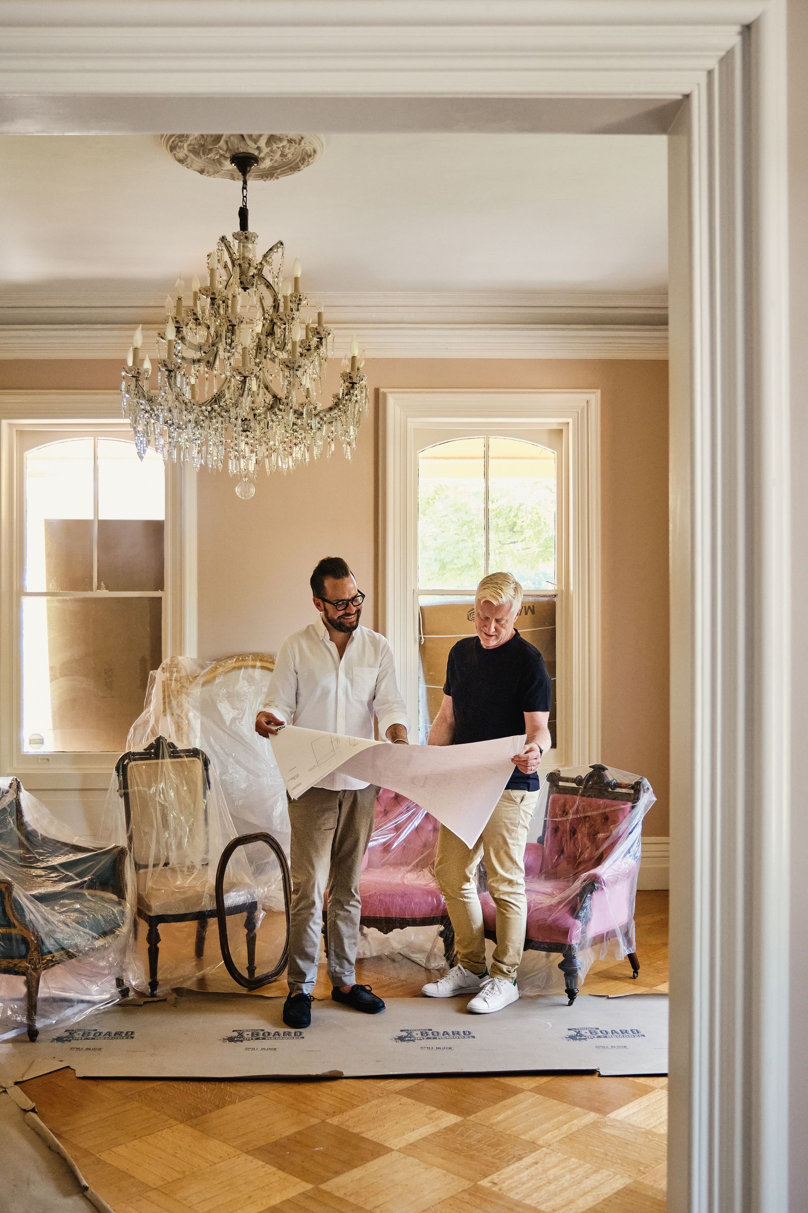 Kevin and David inspect plans at a property in development.
