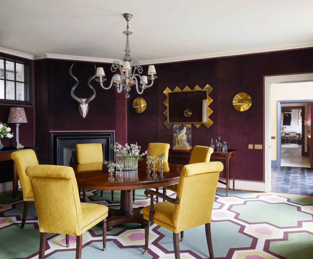 A custom ‘Cordoba rug from Vanderhurd picks up on dining chairs in Claremonts ‘Cunard chenille and walls lined in George...