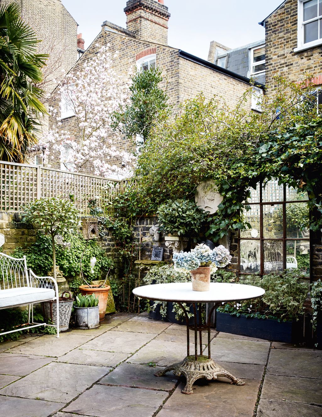 Phoebe and Luke found the antique metal table in Tetbury. A mirror on the back wall reflects the light and makes the...