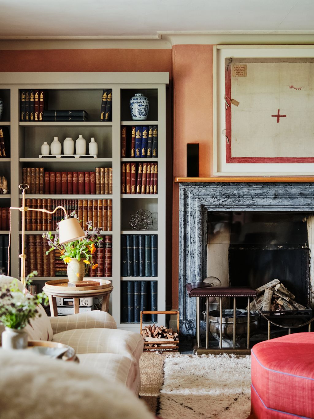 Above the fireplace hangs a framed Chinese early Red Cross Siege flag from the Boxer Rising.