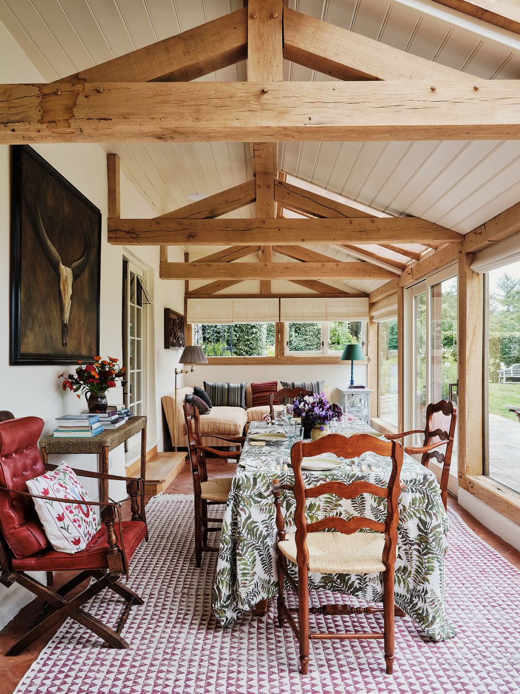 The conservatory is a new addition to the house constructed in a space that was formerly a veranda. The campaign chair...