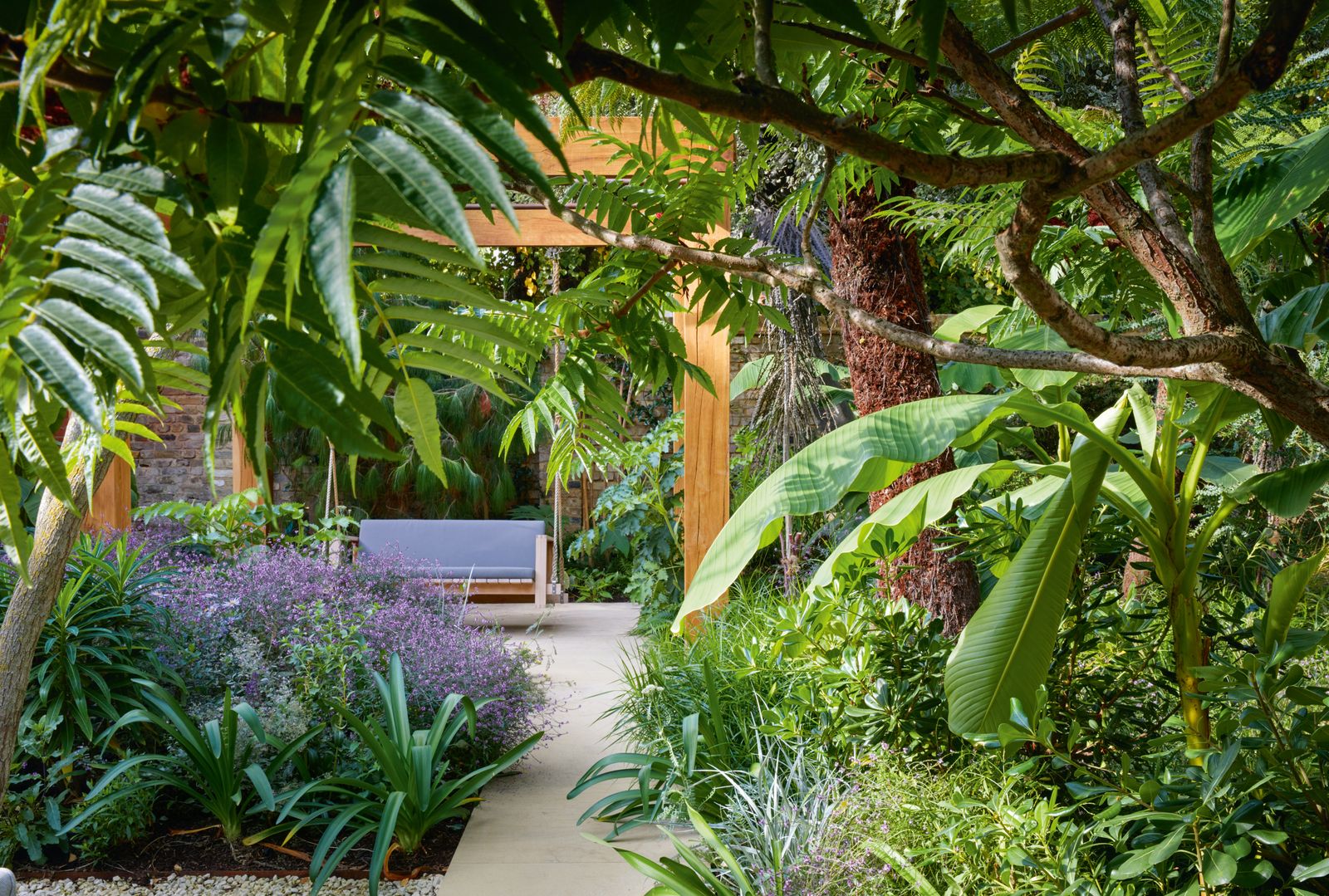Jinny has created an extraordinary secret garden filled with lushly textured foliage in myriad shades of green where...