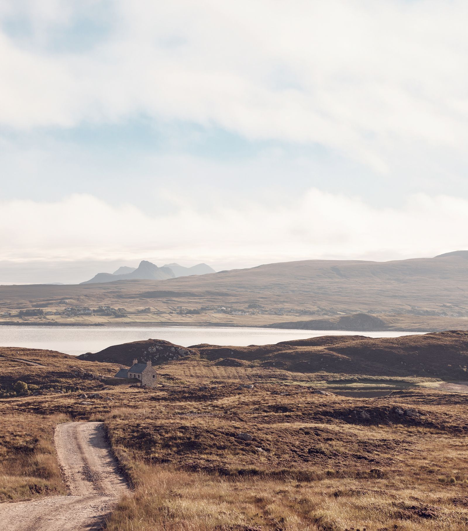 A winding trail wends its way down to the farmhouse which has views over the sea towards the mainland and mountains