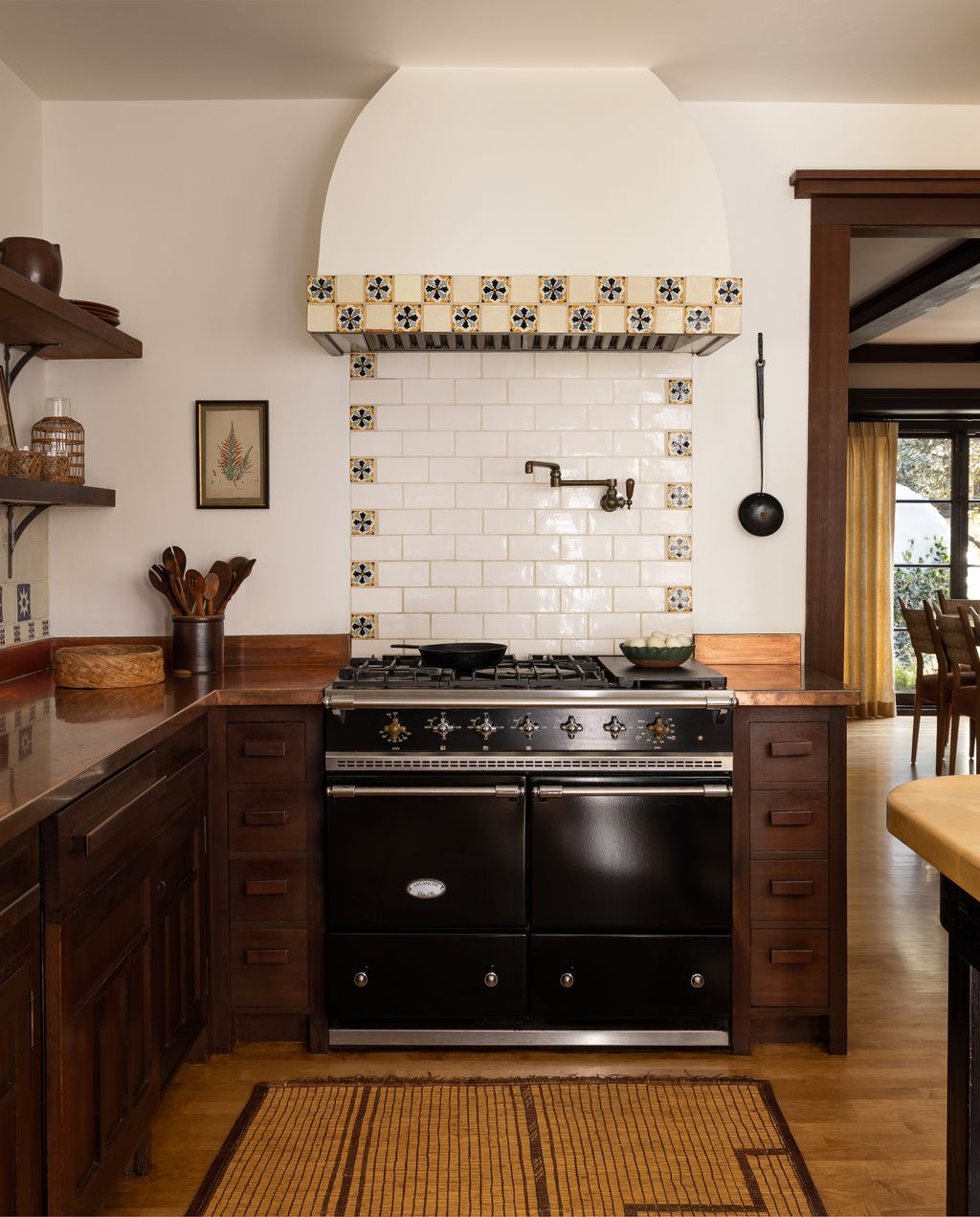 The vintage tilework around thenbspLaCanche range was a design update made by the previous owners of the home. The rug...
