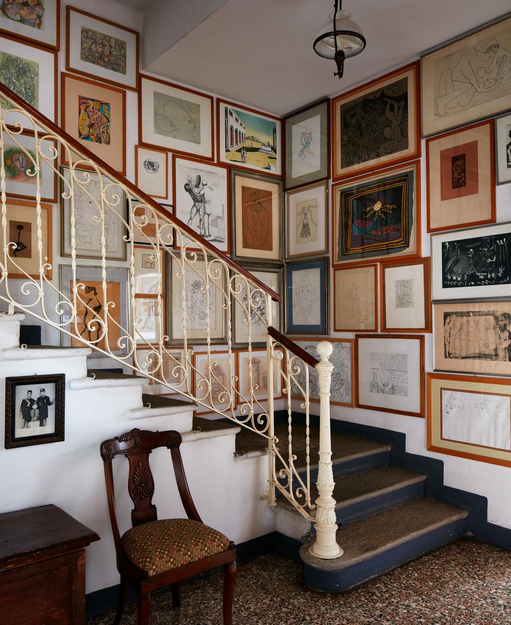 A dense gallerystyle hang of artwork is a wonderful way to add interest to a staircase but it is wise to plan your...