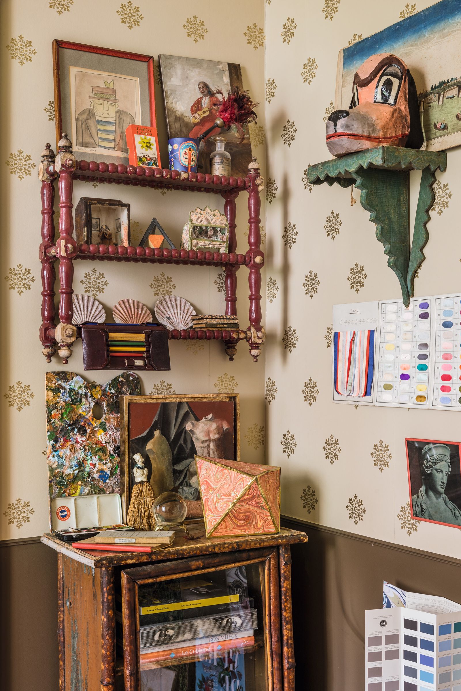 Marins studio and its pleasing jumble of poetic objects globes a collection of old drawing portfolios covered with...