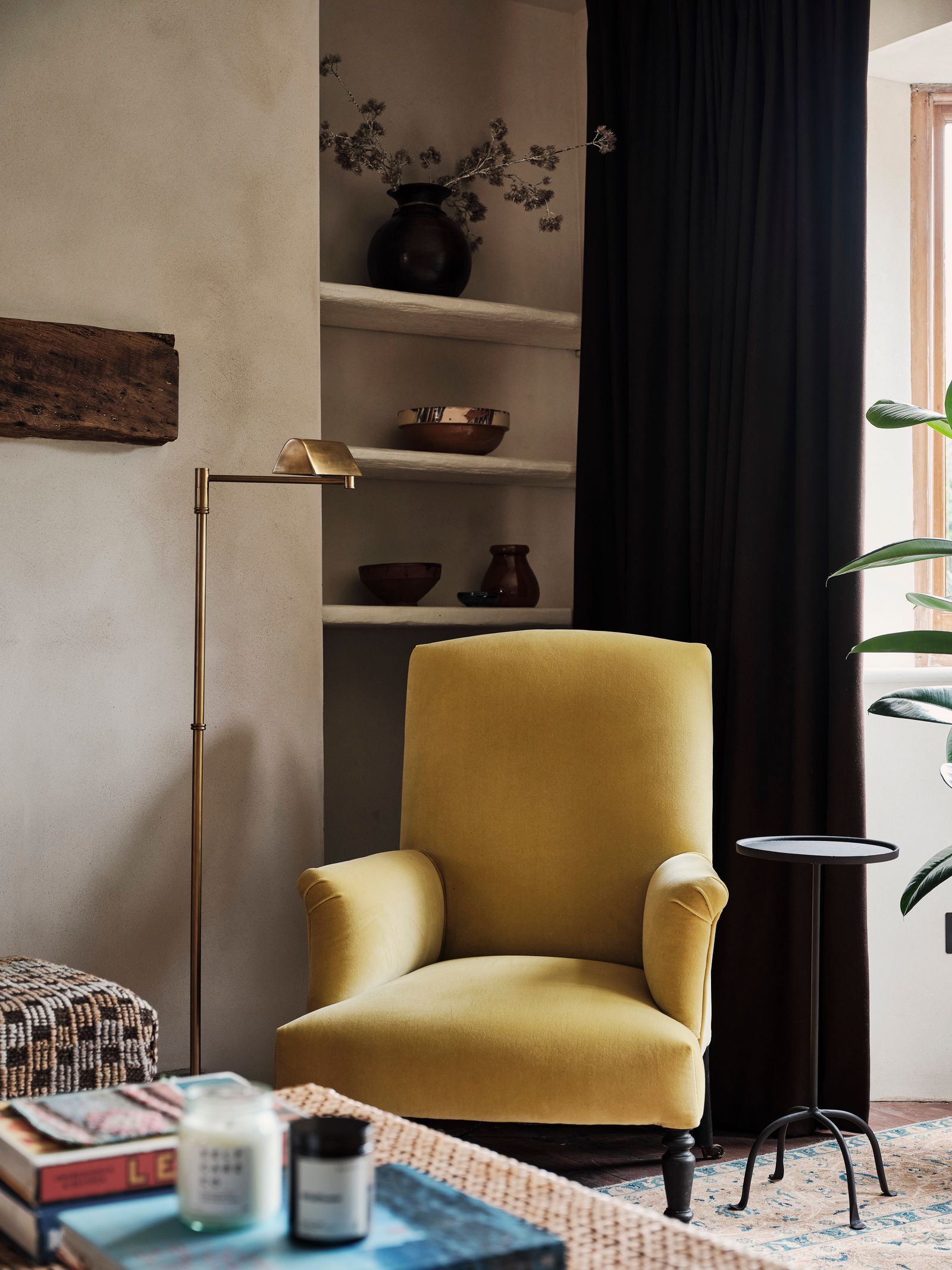 The floor lamp is from Soho Home and stands next to a Napoleon III armchair reupholstered in Designers Guild's Cassia...