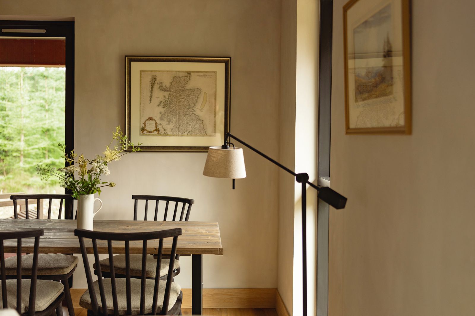 Classic wooden pieces furnish the dining area in Juniper. Claire SpencerChurchill. Larch is decorated in rich blues and...