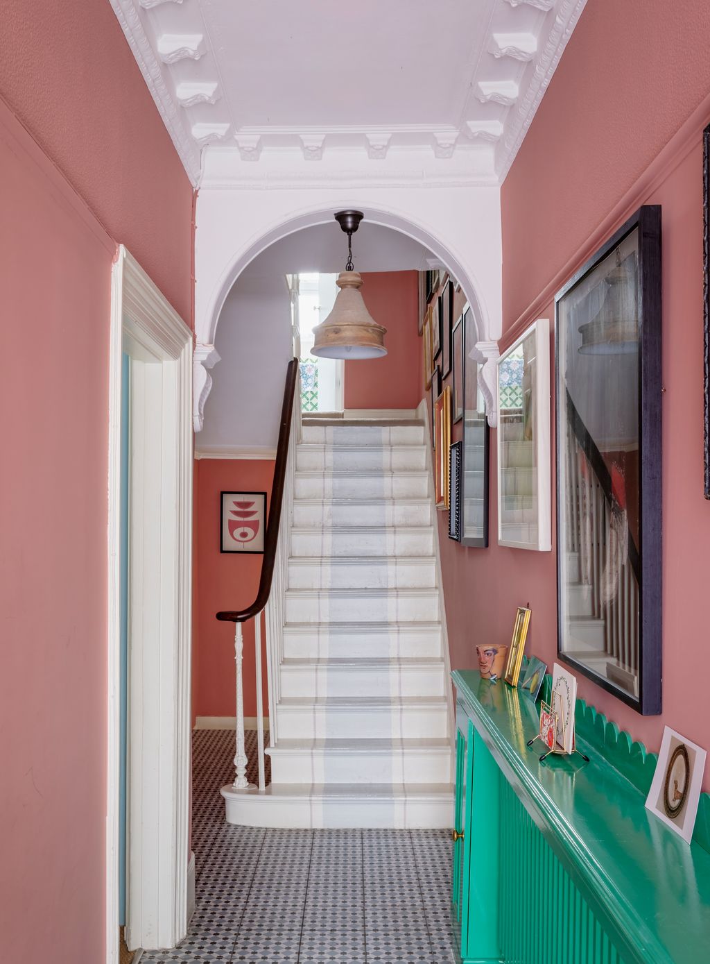 Rendered in Farrow and Ball's ‘Fruit Fool the entrance hall is an instant shot of vitamin C. The lacquered radiator...