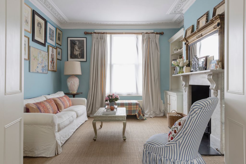 The painting on top of the mirror is one of Alice's own. The elephants and goats are in Lacy Gallery frames.