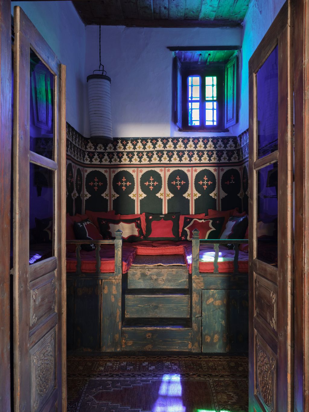 Looking through to the raised platform of the Turkish Sofra Room on the left and a guest bedroom on the right. The doors...