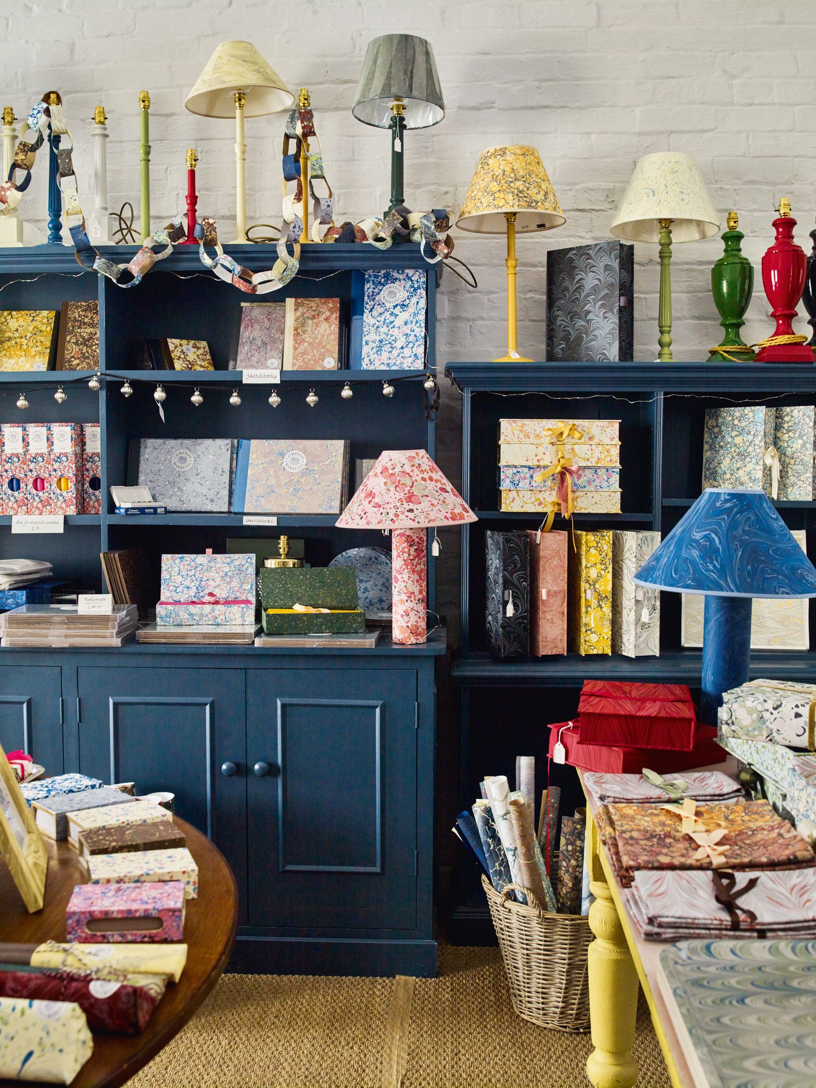 The Wiltshire shop sells accessories including lampshades notebooks and boxes made with marbled papers.