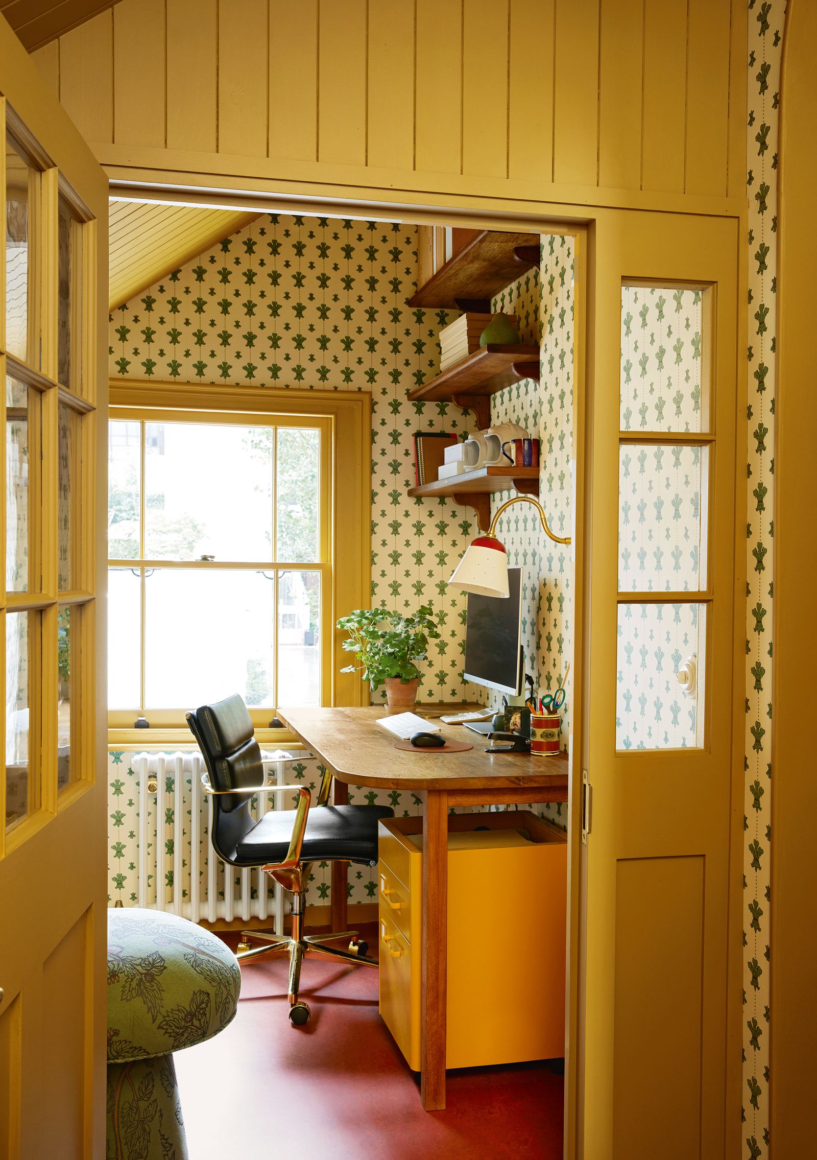 Beatas husband John Finlay managing director of the business works from this cosy upstairs space. Woodwork painted in a...