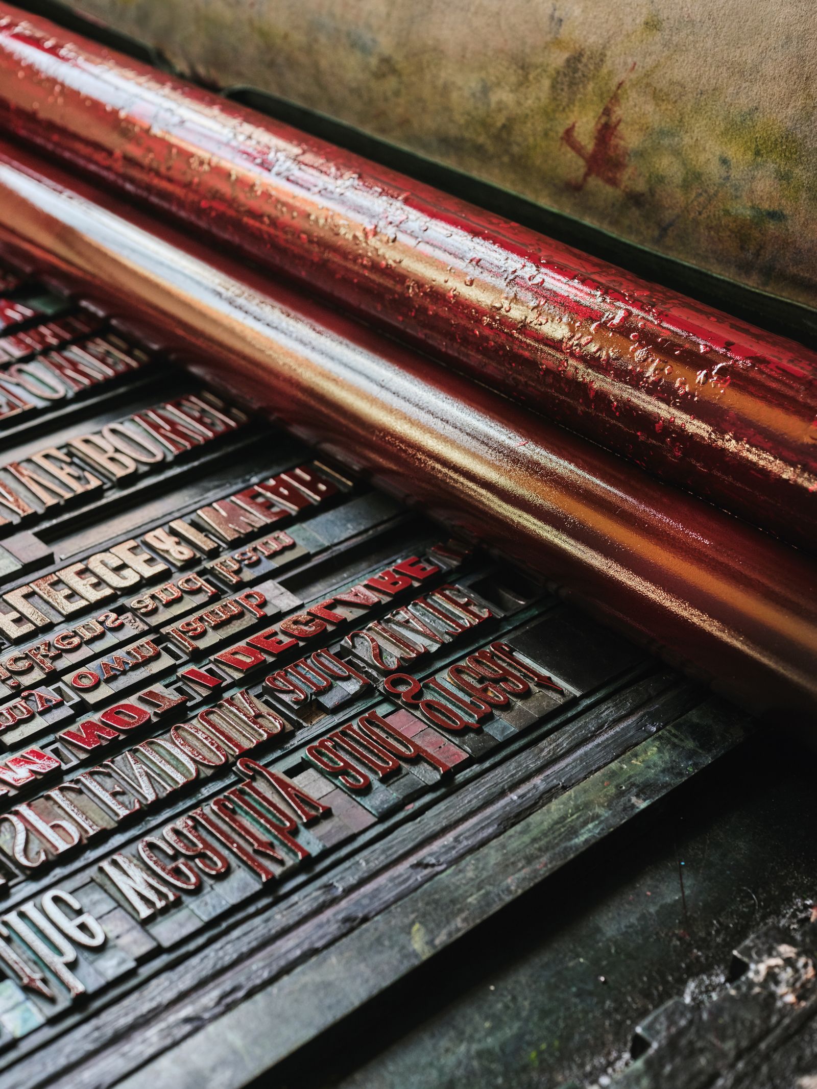 He lays the letters upside down and back to front before applying handmixed ink.
