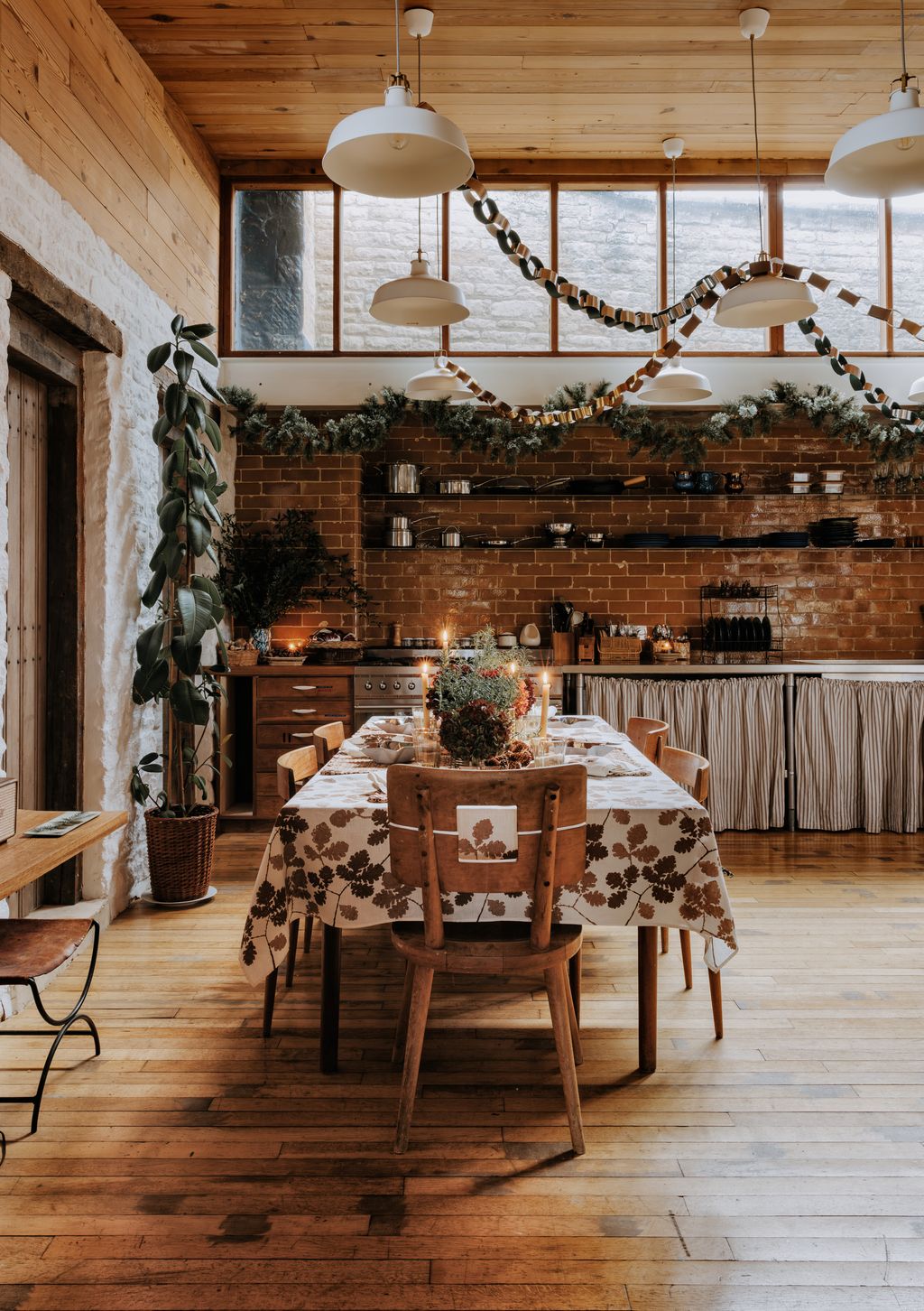 Elswhere in her Cotswold guest cottage Amanda Brooks has opted for paper chains simply made from silver and green and...