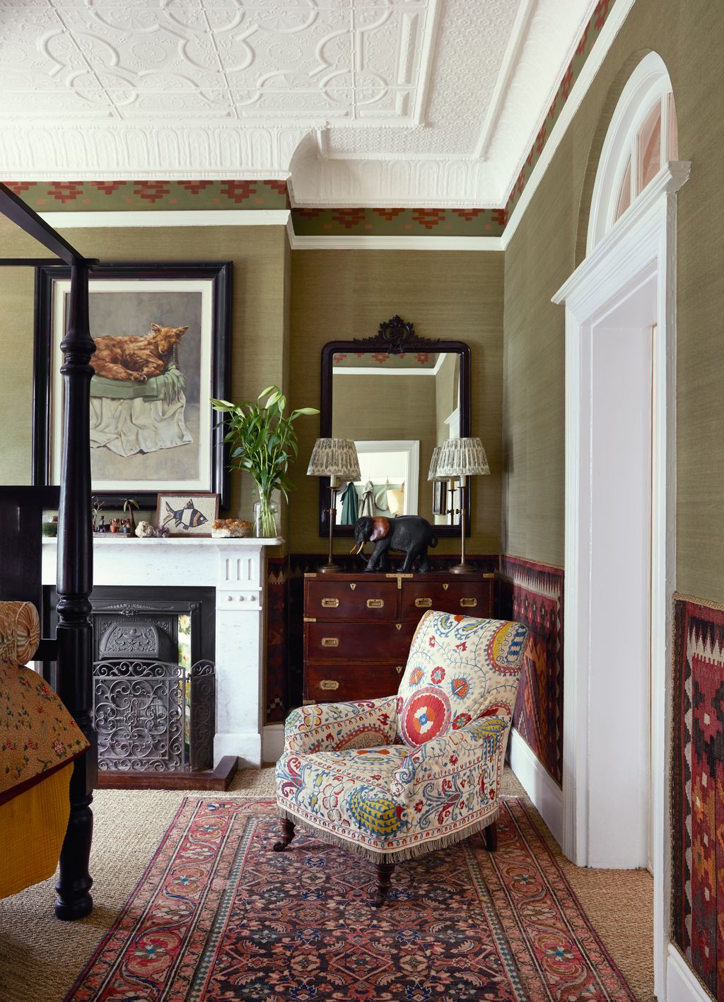 In the main bedroom a chair in an Uzbek adras suzani picks up on the kilim lining the lower walls.