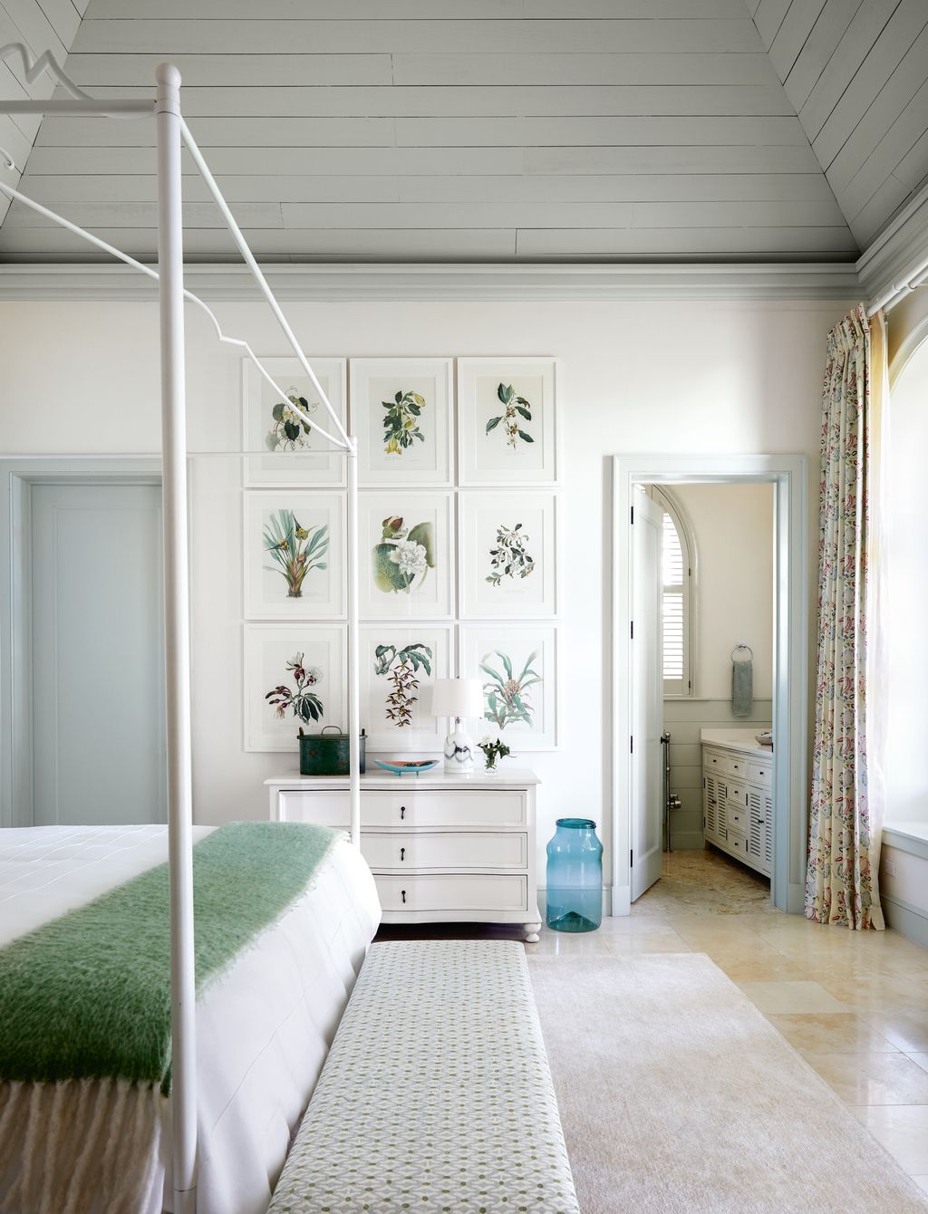 In the spare room framed pages from Flowers of the Brazilian Forests by Margaret Mee set the tone for this verdant...