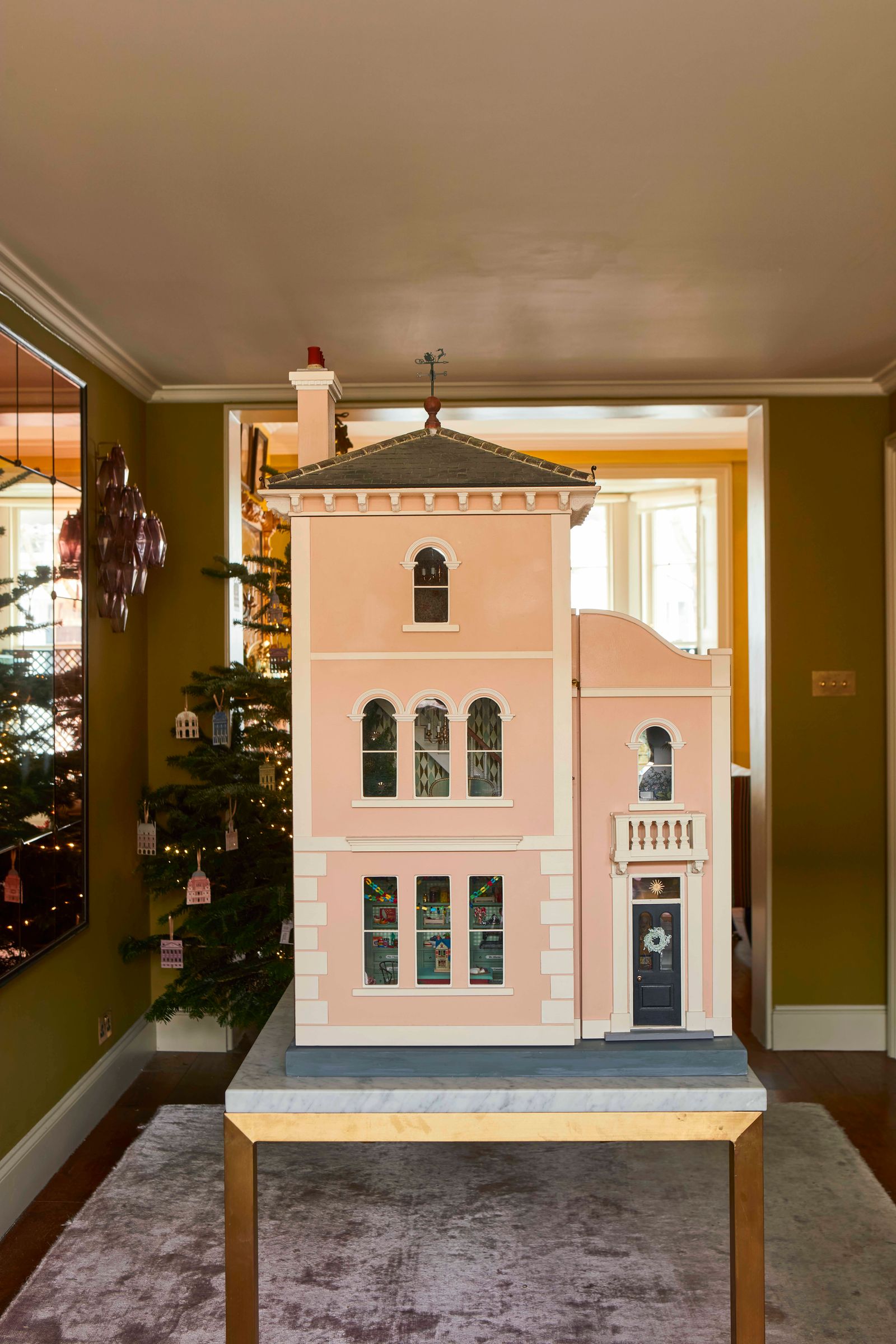 The intricate decoration of a magical Christmas doll's house