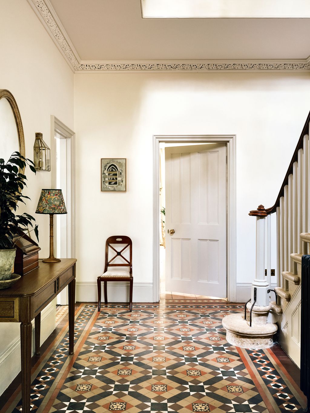 In the hall Howe Londons ‘Irish Slim table and a Georgian mahogany chair from The French House stand on the Victorian...