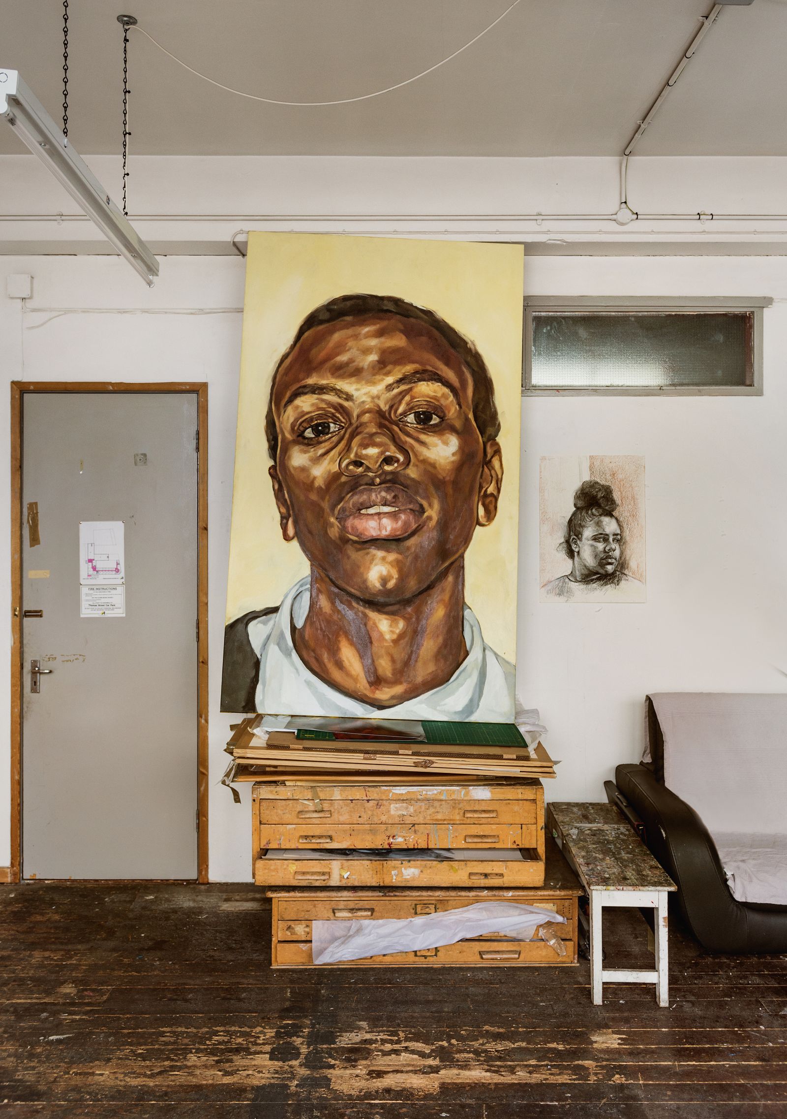 A portrait of her son Solomon titled Pride oil on canvas 2001 next to it is Margate charcoal and pastel on paper 2020.