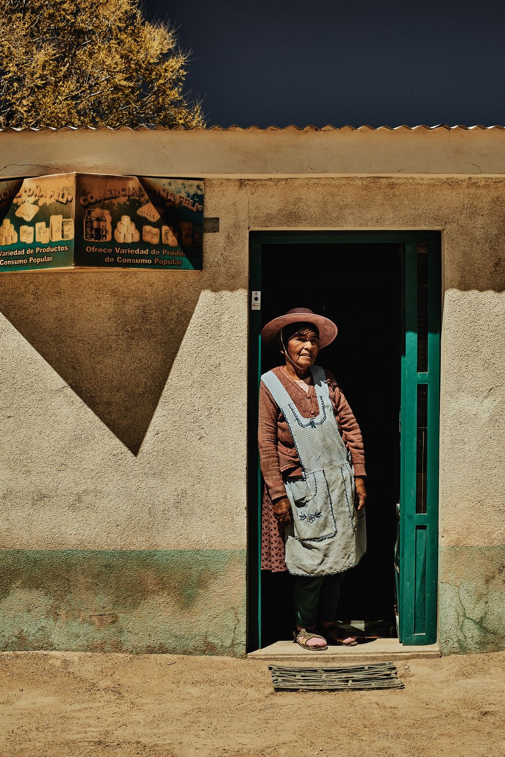 A woman in the doorway of her shop in the village of San Juan in Bolivia.