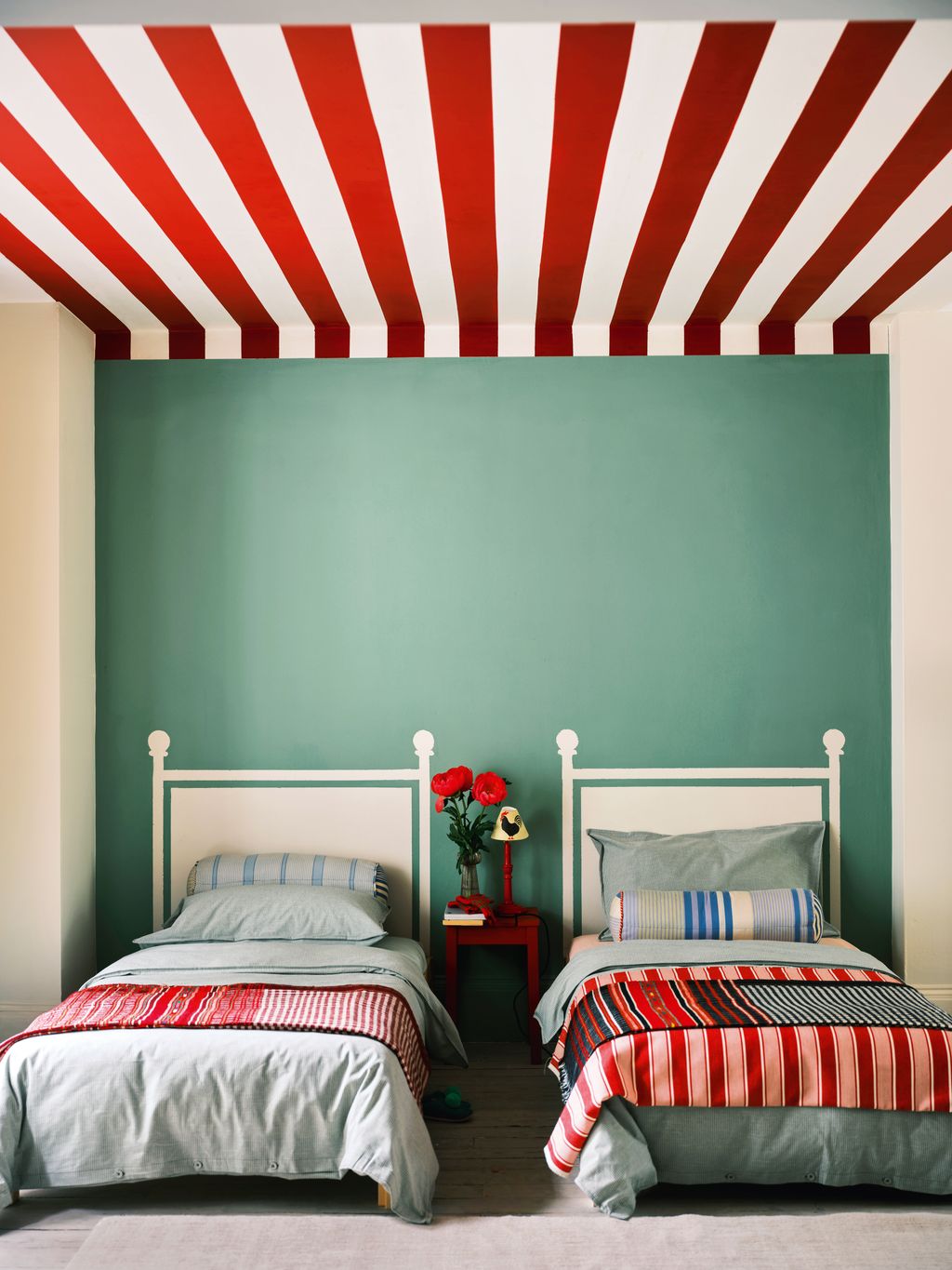 Murals offer a versatile alternative to a headboard as they can be reimagined or refreshed over time. Here ‘School House...