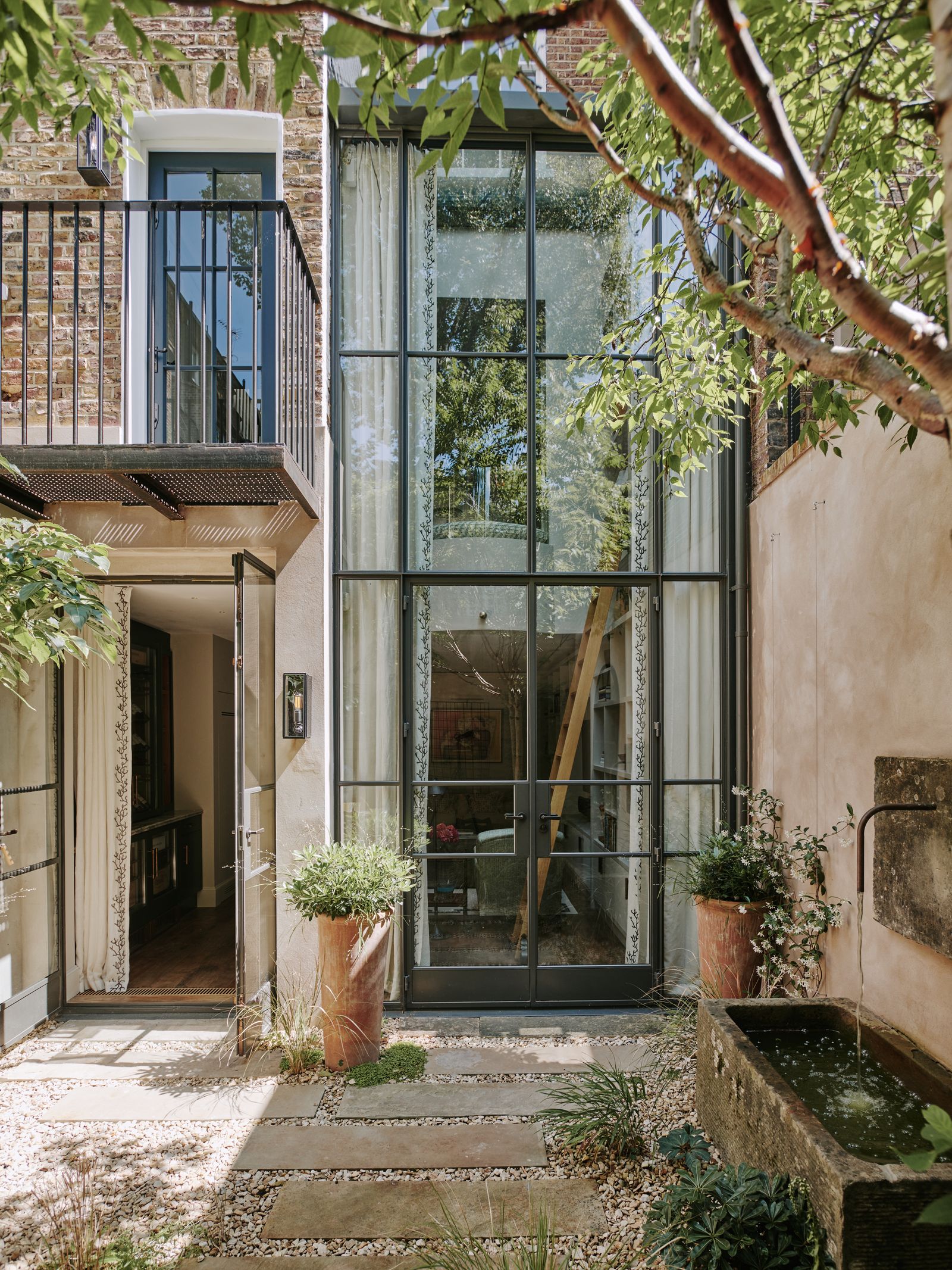 A double height extension as in this Chelsea townhouse is highly desirable