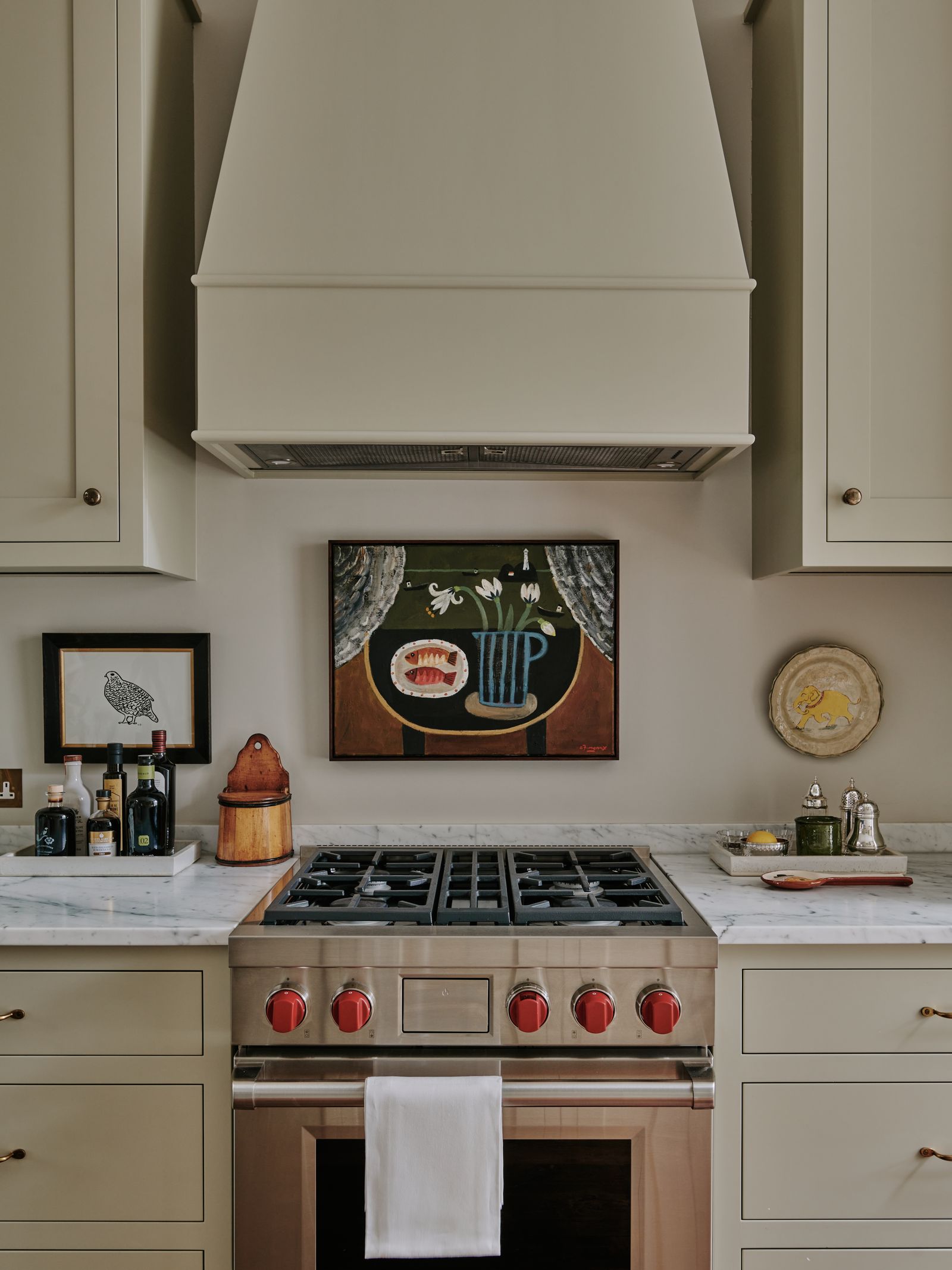 Artwork takes centre stage in this kitchen by Steph Hill and Honor Devereux. The wall plate is by Claudia Rankin the...