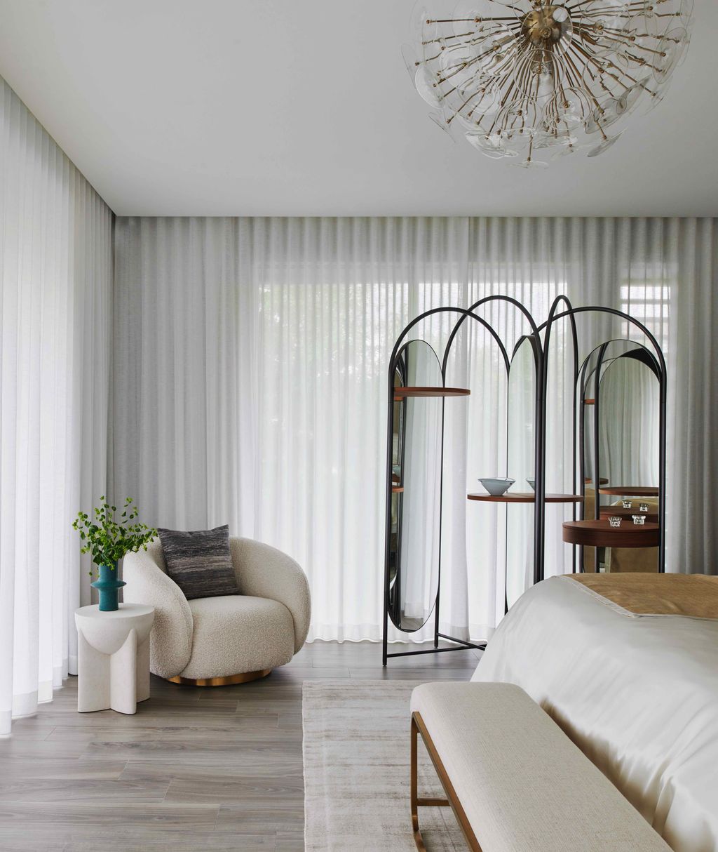Assure Interiors used a silk blend wallcovering to make this bedroom from their project in Florida feel cosy and...