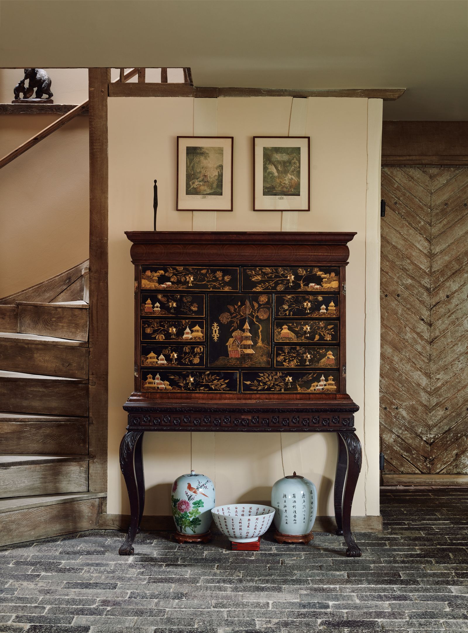 Chinese ceramics are grouped below a 19thcentury chinoiserie cabinet Catherine removed the doors to reveal its beautiful...