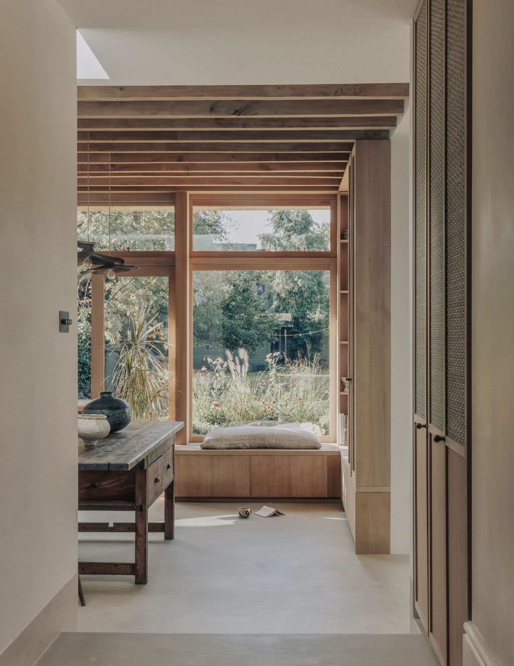 The kitchen of the interior designer Laura Logan's house looks out onto the garden and has lots of clever storage hidden...
