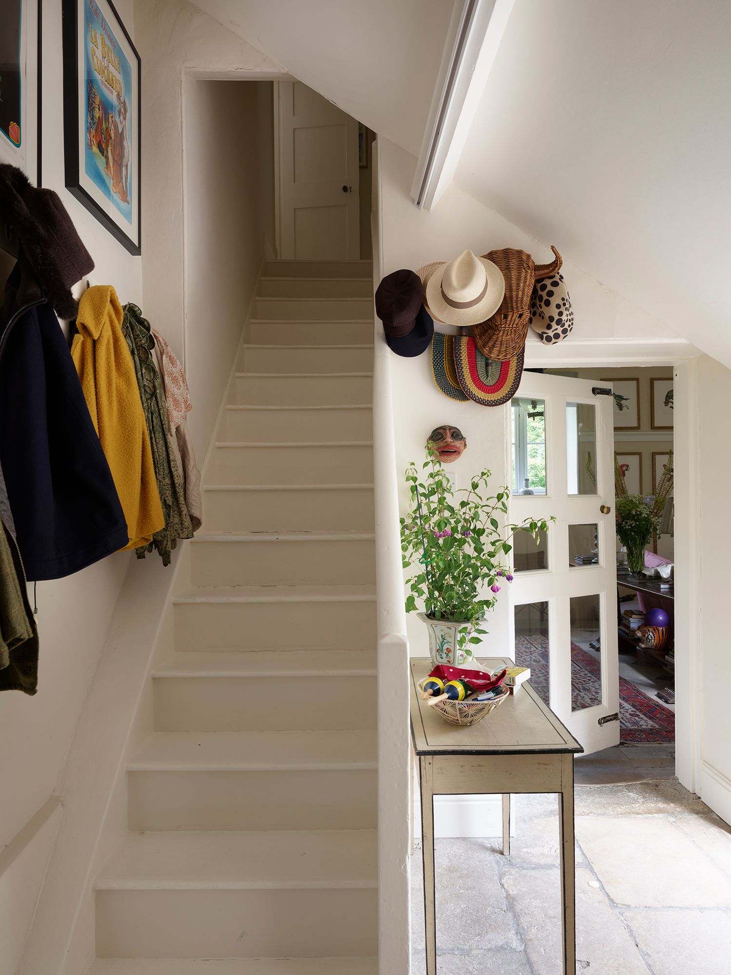 An antique handpainted console table stands in the hallway.