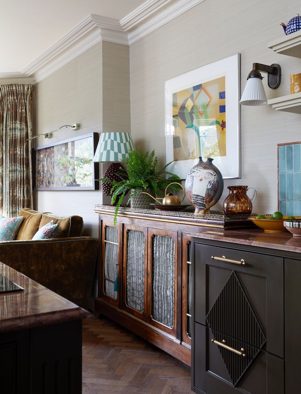 The cabinet delineates the move from the kitchen to the living room. It was restored by Laura and her team who added a...