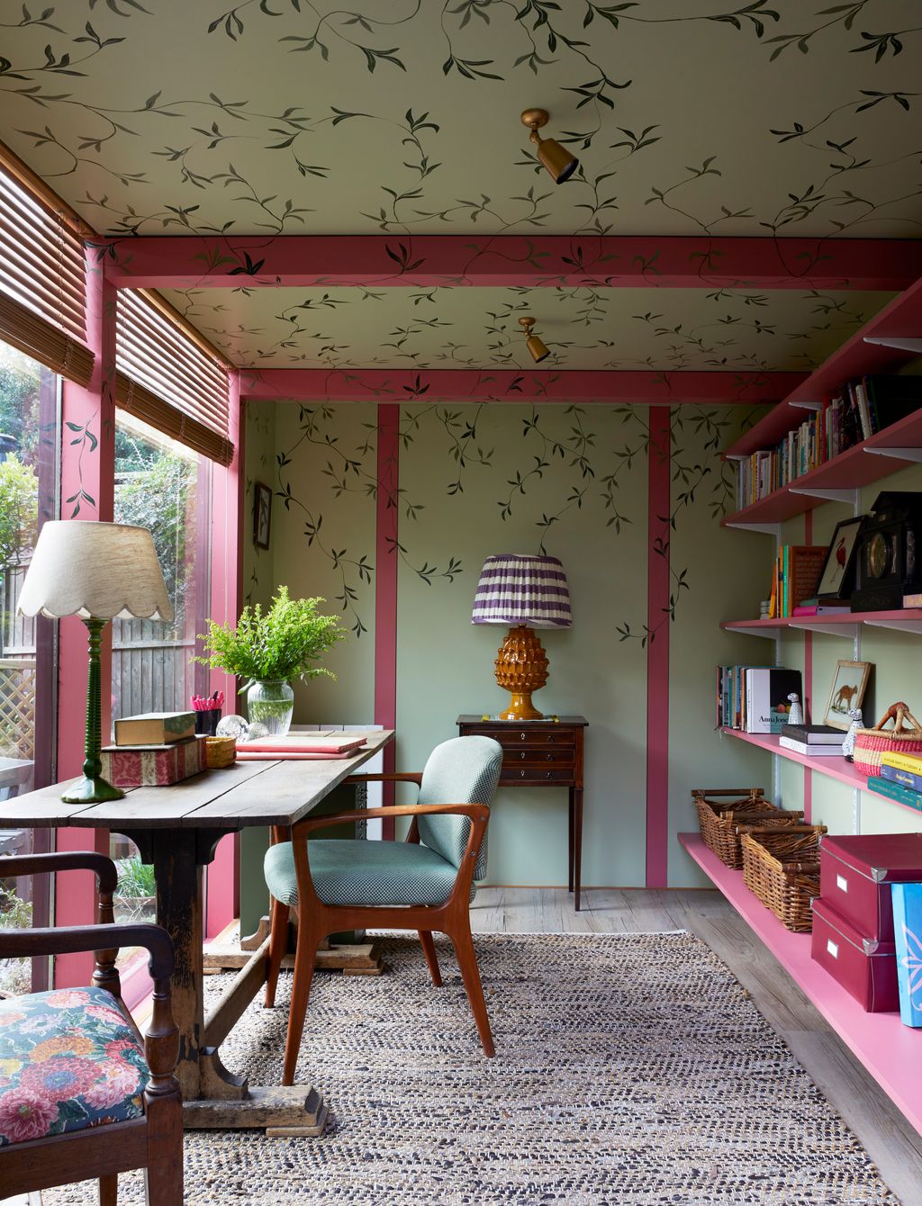 Image may contain Lamp Chair Furniture Indoors Interior Design Home Decor Desk Table Rug Plant and Architecture