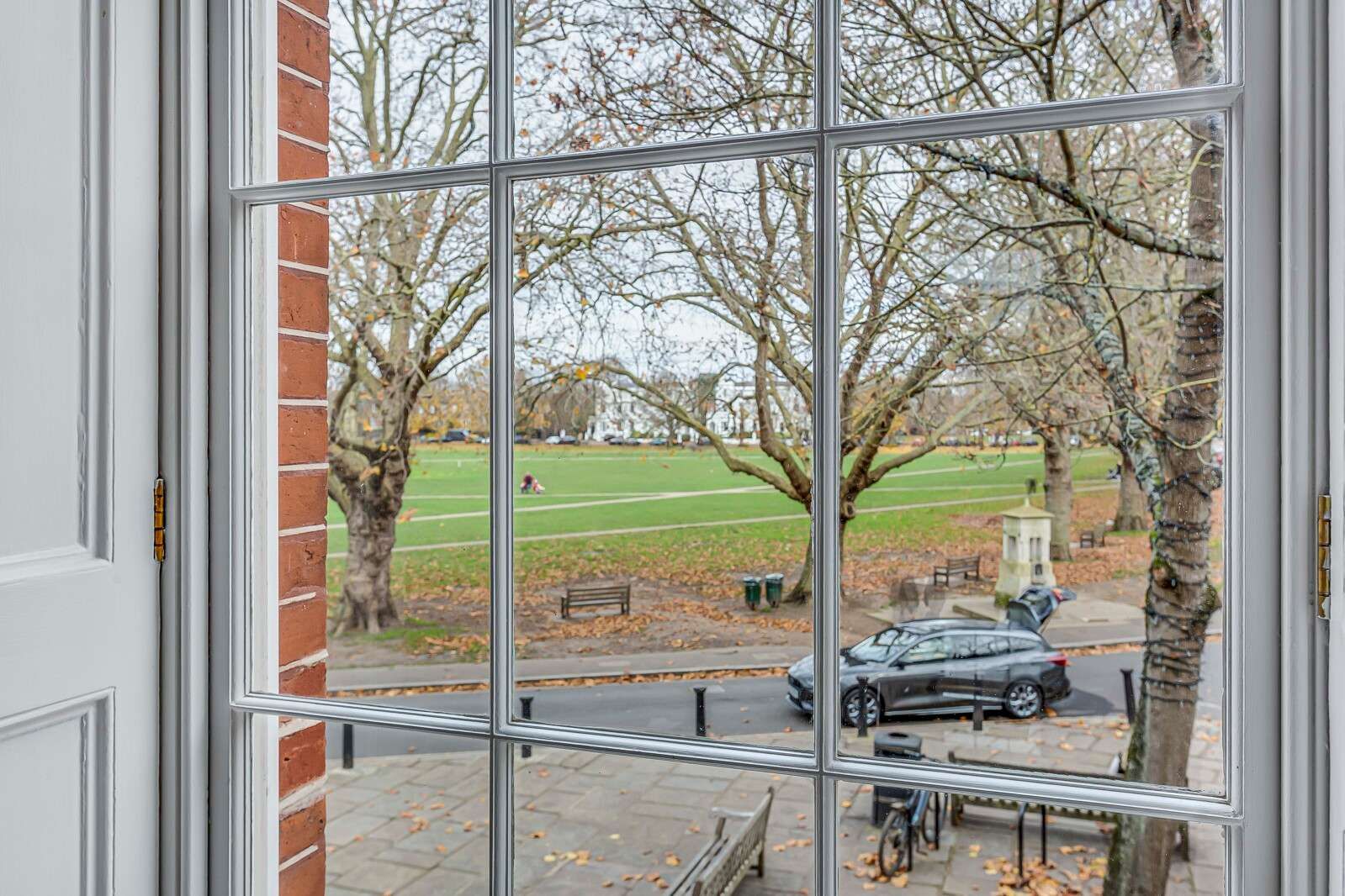 Image may contain Car Transportation Vehicle Bench Furniture Window French Window Person and Bicycle