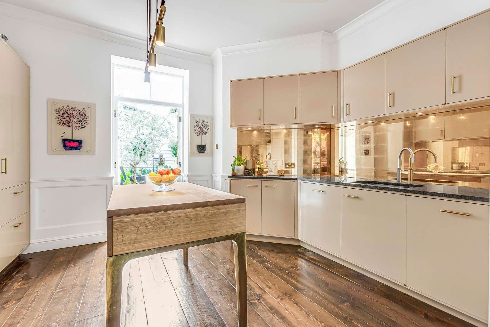 Image may contain Indoors Interior Design Kitchen Home Decor Wood Kitchen Island Plant and Floor