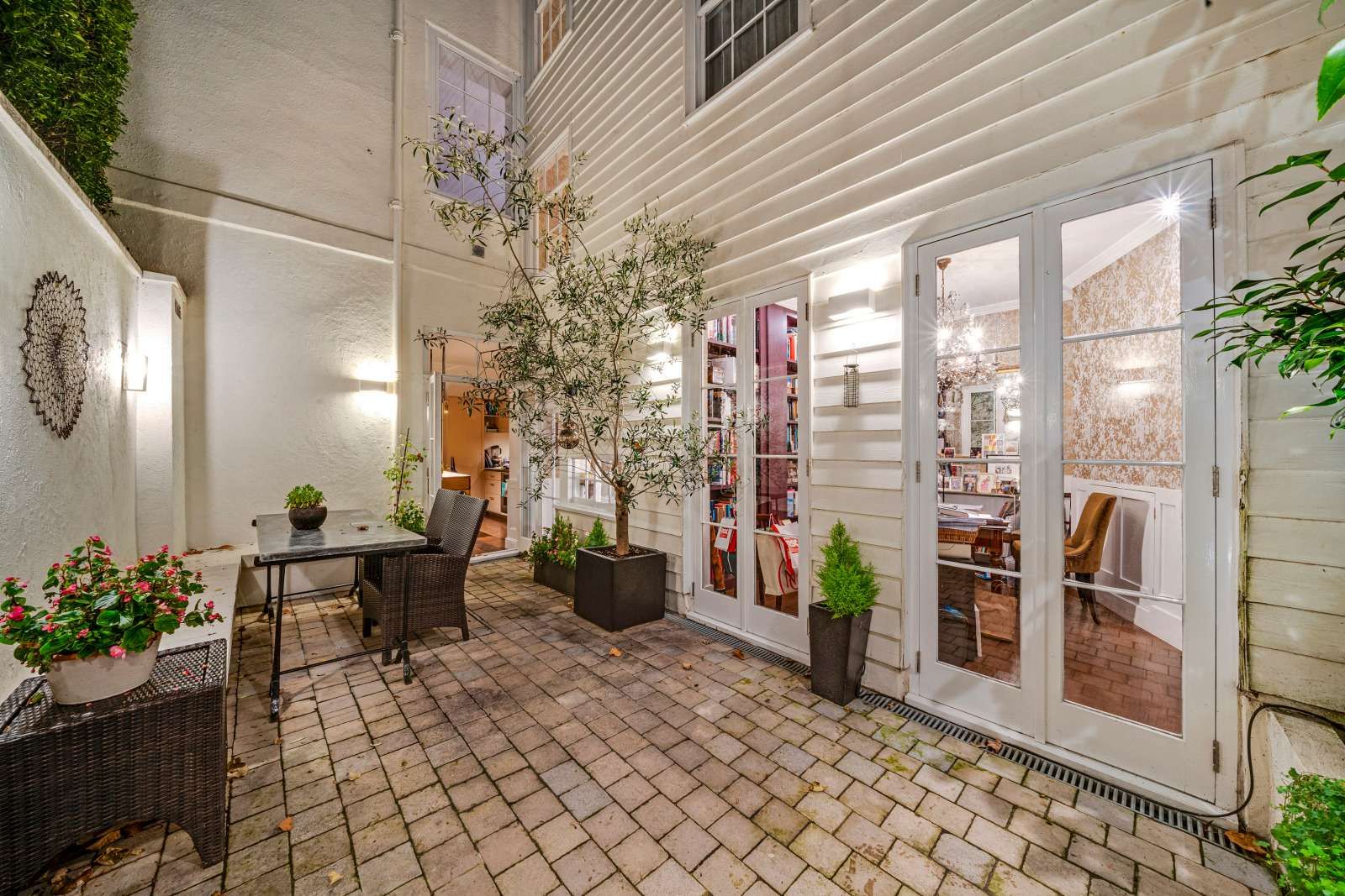 Image may contain Door Plant Desk Furniture Table Architecture Building Housing Chair Indoors and Interior Design