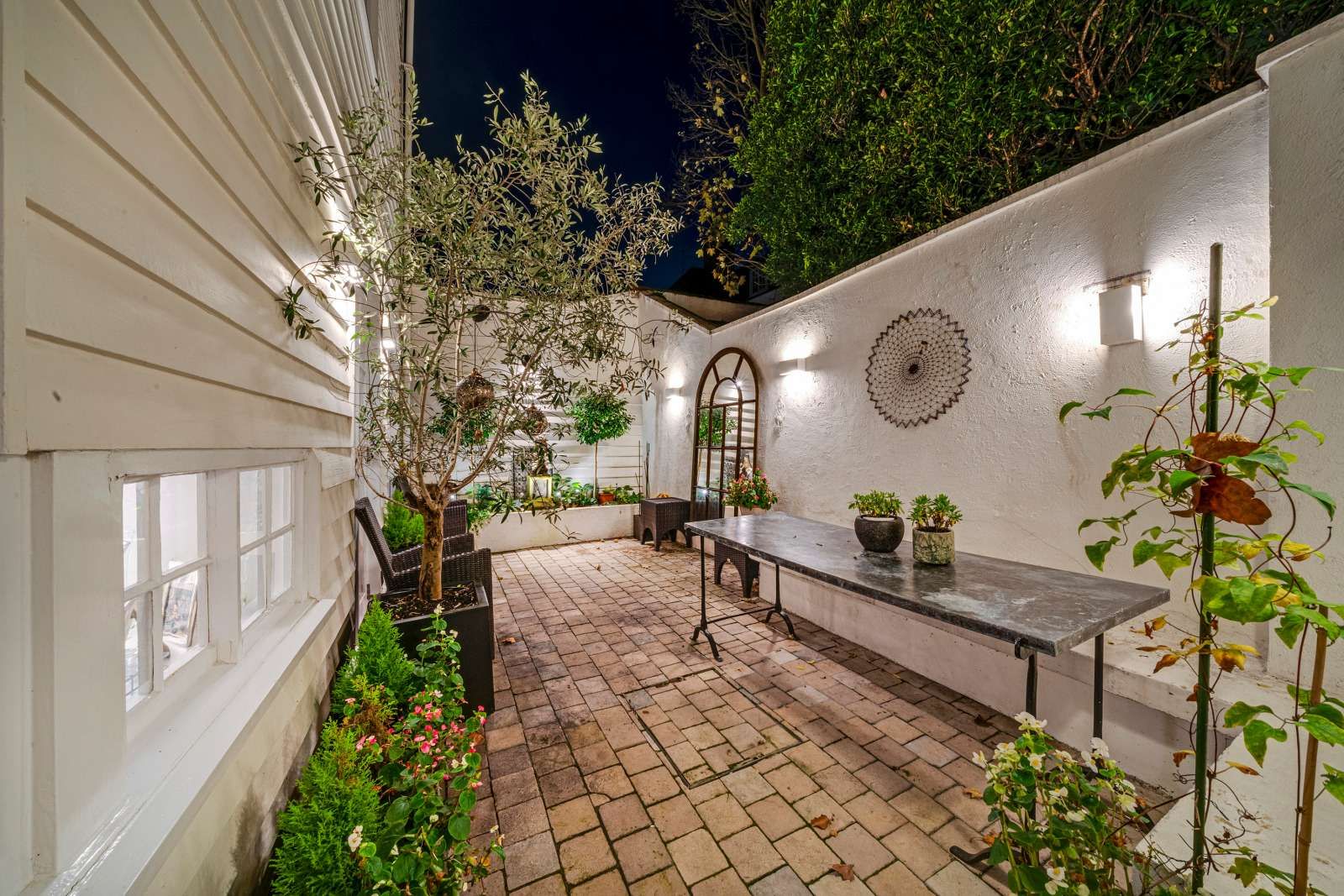 Image may contain Backyard Nature Outdoors Yard Indoors Interior Design Plant Garden Desk Furniture and Table