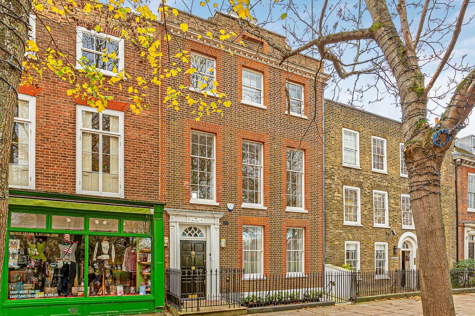 Image may contain City Architecture Building Housing Urban House Person Row House and Lamp