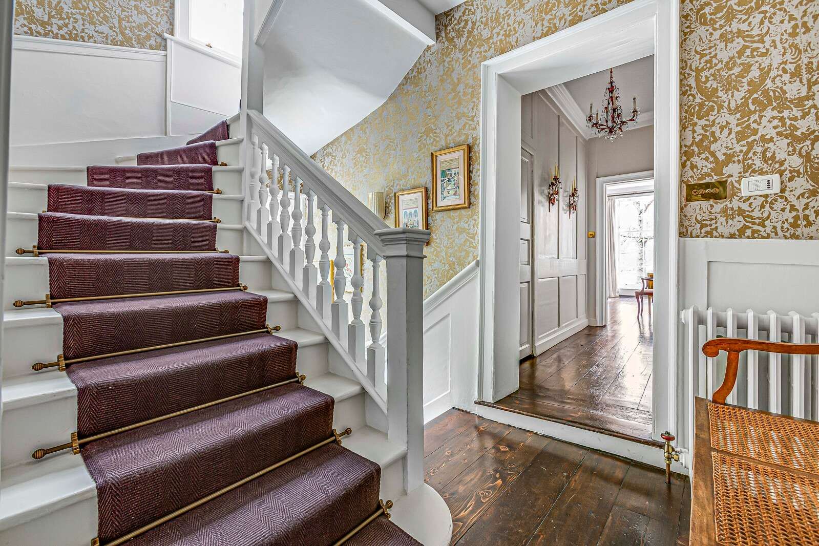 Image may contain Architecture Building Foyer Indoors Chandelier Lamp Art Painting House Housing and Staircase