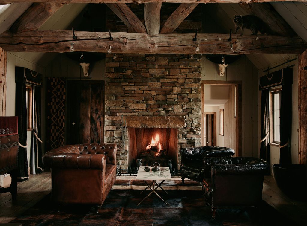 Image may contain Fireplace Indoors Interior Design Hearth Architecture Building Furniture Living Room and Room