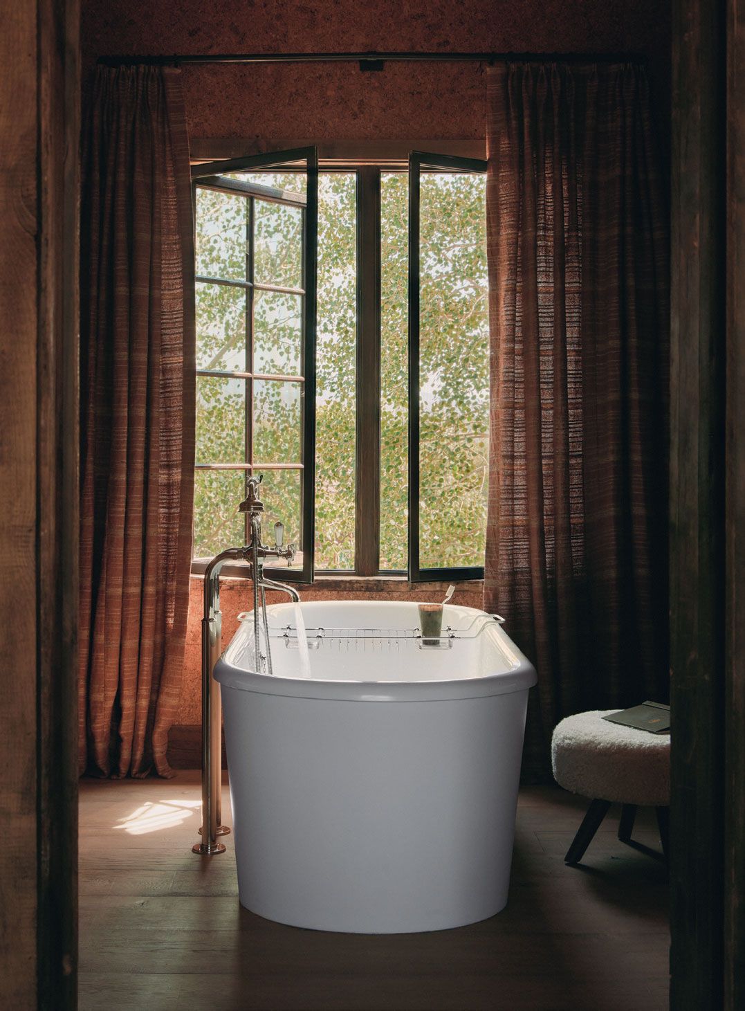 Image may contain Bathing Bathtub Person Tub Indoors Interior Design Book Publication and Window