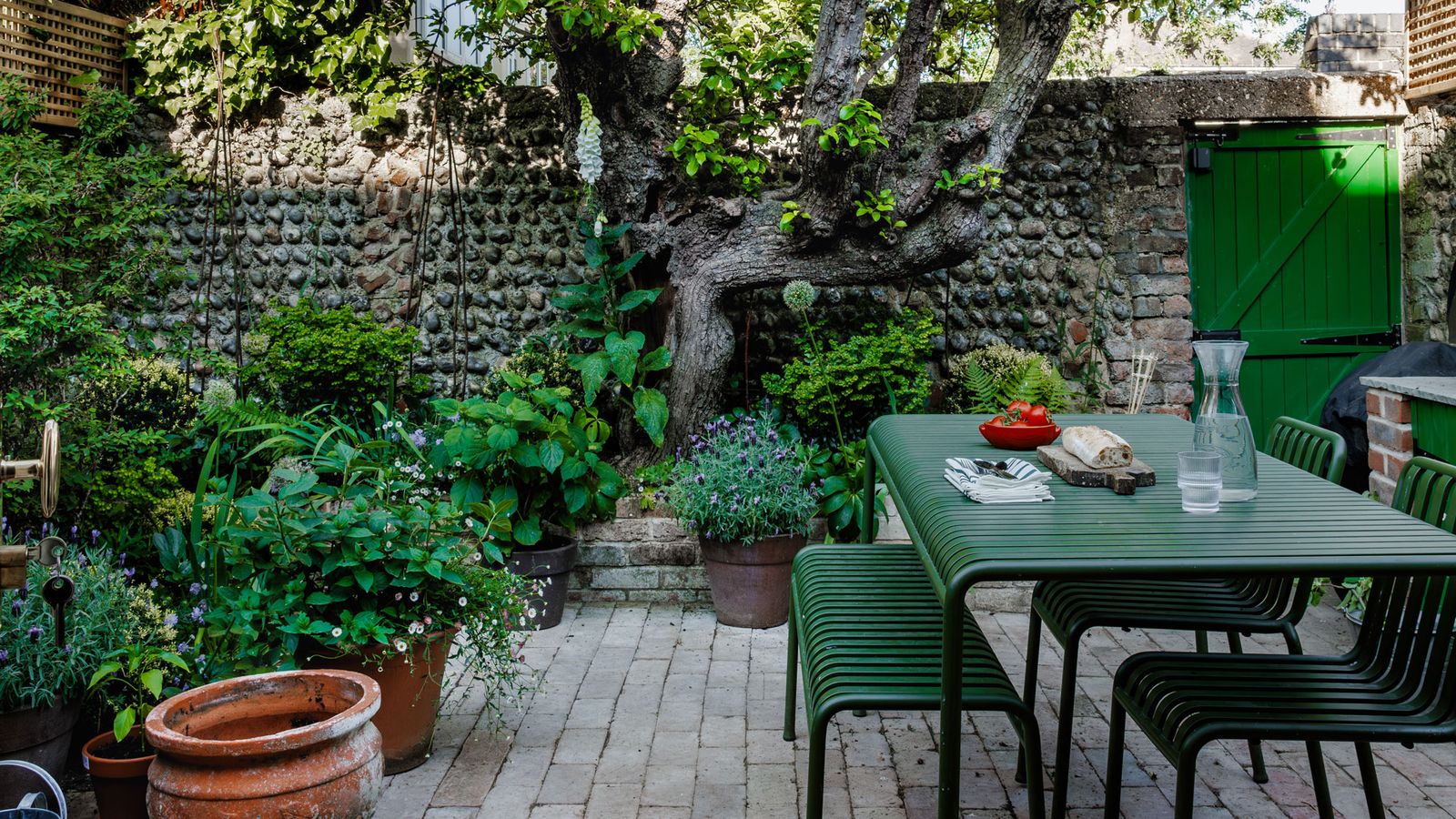 Image may contain: Backyard, Nature, Outdoors, Yard, Garden, Indoors, Interior Design, Furniture, Table, and Plant