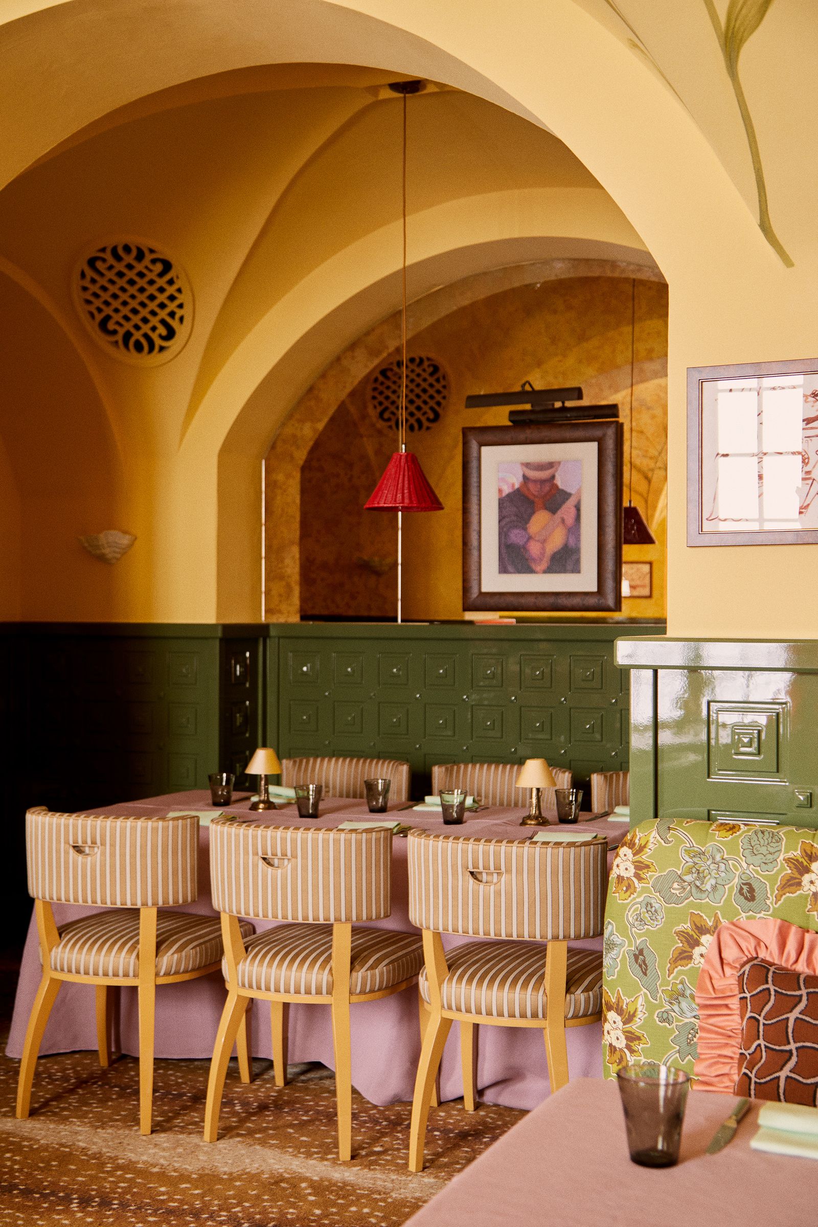 Image may contain Architecture Building Dining Room Dining Table Furniture Indoors Room Table Cup Lamp and Art