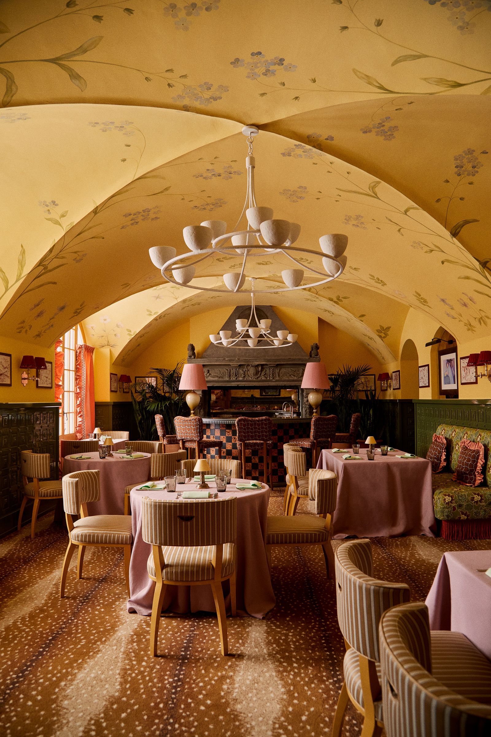 Image may contain Architecture Building Dining Room Dining Table Furniture Indoors Room Table Lamp Chair and Art